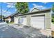 Detached multi-stall garages with well-manicured lawns and easy access from the alleyway at 1826 N Alabama St, Indianapolis, IN 46202