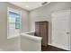Hallway with a storage cabinet and a view of the exterior at 1826 N Alabama St, Indianapolis, IN 46202