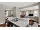 Bright kitchen opens into the living room with white countertops and stainless steel sink at 1826 N Alabama St, Indianapolis, IN 46202
