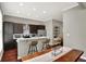 Modern kitchen with stainless appliances, bar seating and dark cabinets at 1826 N Alabama St, Indianapolis, IN 46202