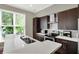 Bright and modern kitchen with stainless appliances, lots of cabinet space, and a large window at 1826 N Alabama St, Indianapolis, IN 46202