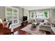 Inviting living room boasts hardwood floors, large windows, and a comfortable sectional sofa at 1826 N Alabama St, Indianapolis, IN 46202