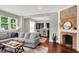 Comfortable living room with hardwood floors and an open floor plan to the kitchen at 1826 N Alabama St, Indianapolis, IN 46202