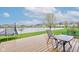 Enjoy backyard views from this home's back deck, which features a table, chairs, and peaceful lake views at 1839 Silverton Dr, Avon, IN 46123
