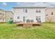 View of the backyard with a deck, table and chairs at 1839 Silverton Dr, Avon, IN 46123