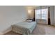 Simple bedroom with a twin bed, window, and neutral decor, offering a calming and comfortable environment at 1839 Silverton Dr, Avon, IN 46123