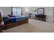 Bedroom featuring a large bed, TV, desk, and chest of drawers in a carpeted space at 1839 Silverton Dr, Avon, IN 46123