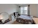 Well-lit bedroom features a patterned bed, storage units, and a large mirror for a modern and organized space at 1839 Silverton Dr, Avon, IN 46123