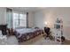 Bright bedroom with a colorful bed, desk, and window, offering a comfortable and functional living space at 1839 Silverton Dr, Avon, IN 46123