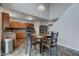 Kitchen with stainless steel appliances, wood cabinets, and adjacent dining area at 1839 Silverton Dr, Avon, IN 46123