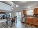 Bright kitchen with stainless steel appliances and wood cabinets and a combined dining space perfect for Gathering meals at 1839 Silverton Dr, Avon, IN 46123