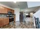 Bright kitchen with stainless steel appliances, wood cabinets, and open floor plan at 1839 Silverton Dr, Avon, IN 46123