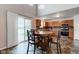 Open kitchen and dining area with wood cabinets and view to the pond at 1839 Silverton Dr, Avon, IN 46123