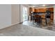 View of the dining area leading to a modern kitchen with wood cabinets and stainless steel appliances at 1839 Silverton Dr, Avon, IN 46123