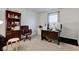 Well-lit home office with a large desk, comfortable chair, and ample storage space at 1839 Silverton Dr, Avon, IN 46123