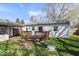 Backyard view featuring a small wooden deck attached to the house and a patch of grass at 1933 Ruth Dr, Indianapolis, IN 46240