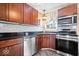 Functional kitchen featuring stainless steel appliances, sleek countertops, and tiled flooring at 1933 Ruth Dr, Indianapolis, IN 46240