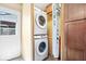 Laundry room with stacked Samsung washer and dryer and a linen closet at 1933 Ruth Dr, Indianapolis, IN 46240