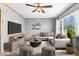 Bright living room with modern furnishings, ceiling fan, and large window views at 1933 Ruth Dr, Indianapolis, IN 46240
