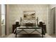 Charming bedroom featuring a wrought iron bed, patterned wallpaper, and complementary bedside tables at 19565 Boulder Brook Ln, Westfield, IN 46074
