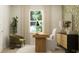 Stylish study with a wooden desk, comfortable chair, and decorative wallpaper at 19565 Boulder Brook Ln, Westfield, IN 46074