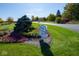 Avon Gardens community entrance with colorful landscaping and a well-manicured lawn on a sunny day at 2167 Warbler St, Danville, IN 46122