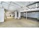 Spacious unfinished basement with exposed ceiling, concrete flooring, and visible utilities at 217 S 17Th Ave, Beech Grove, IN 46107