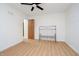 Bedroom highlighting laminate floors, a metal bench and natural light from windows at 217 S 17Th Ave, Beech Grove, IN 46107