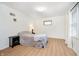 Bright bedroom with a large window, laminate floors, and a cozy feel, perfect for relaxation at 217 S 17Th Ave, Beech Grove, IN 46107