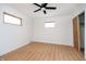 Bedroom showcasing sleek laminate flooring, a contemporary ceiling fan, and windows for natural lighting at 217 S 17Th Ave, Beech Grove, IN 46107