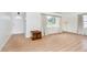 Bright living room featuring wood floors, neutral walls, and ample natural light at 217 S 17Th Ave, Beech Grove, IN 46107
