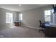 Bright bedroom with ample natural light, neutral walls and carpet, and a desk perfect for a home office at 2237 S Copperstone Dr, New Palestine, IN 46163