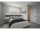Modern bedroom featuring natural light, neutral colors, and stylish décor create a relaxing atmosphere at 2237 S Copperstone Dr, New Palestine, IN 46163