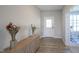 Inviting foyer with hardwood floors and decorative accents, adjacent to a bright office space at 2237 S Copperstone Dr, New Palestine, IN 46163