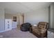 Neutral living room with comfortable seating on carpeted floor with receded lighting at 2237 S Copperstone Dr, New Palestine, IN 46163