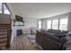Inviting living room features a cozy fireplace, plush seating, and plenty of natural light at 2237 S Copperstone Dr, New Palestine, IN 46163