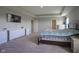 Large primary bedroom featuring modern lighting and decor, including a television and dresser at 2237 S Copperstone Dr, New Palestine, IN 46163