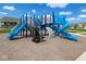 A vibrant blue playground featuring slides and climbing structures provides endless fun in a secure environment at 2237 S Copperstone Dr, New Palestine, IN 46163