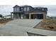 A new two-story home with a two-car garage and a large concrete driveway at 2249 Oakmont Dr, Plainfield, IN 46168
