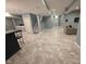 Finished basement boasts an open layout with neutral tones, recessed lighting, and modern flooring at 2325 Silver Rose Dr, Avon, IN 46123