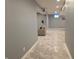Finished basement hallway featuring recessed lighting, gray walls, and stylish, neutral-toned flooring at 2325 Silver Rose Dr, Avon, IN 46123