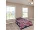 Simple bedroom featuring two large windows with backyard views at 2325 Silver Rose Dr, Avon, IN 46123