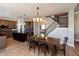 Well-lit dining area with an island kitchen and staircase in view at 2325 Silver Rose Dr, Avon, IN 46123