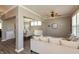 Spacious living area flowing into the dining room, featuring a ceiling fan and a large window at 2325 Silver Rose Dr, Avon, IN 46123