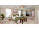 Spacious main bedroom featuring carpet, a seating bench, and a ceiling fan at 2325 Silver Rose Dr, Avon, IN 46123