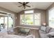 Bright sunroom with large windows overlooking a scenic yard, adjacent to a covered patio at 2325 Silver Rose Dr, Avon, IN 46123