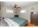 Cozy bedroom featuring a ceiling fan, neutral walls, and natural light from two windows at 2416 Depauw Rd, Indianapolis, IN 46227