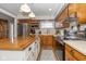 Well-equipped kitchen featuring wooden cabinets, a stainless steel refrigerator, and a kitchen island at 2416 Depauw Rd, Indianapolis, IN 46227