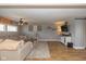 Spacious living room with comfortable seating, wood floors, and a ceiling fan at 2416 Depauw Rd, Indianapolis, IN 46227