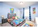 Bright bedroom with Mario themed accents, a bed with storage and large window at 2681 Pumpkin Patch Ln, Indianapolis, IN 46229
